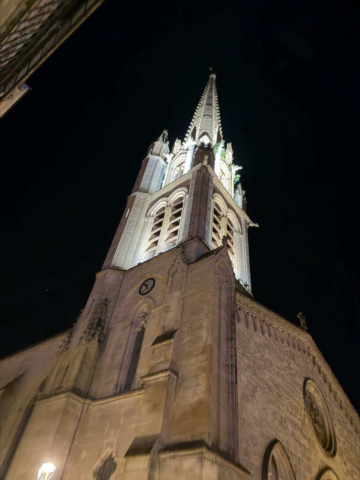 Church tower lit at night