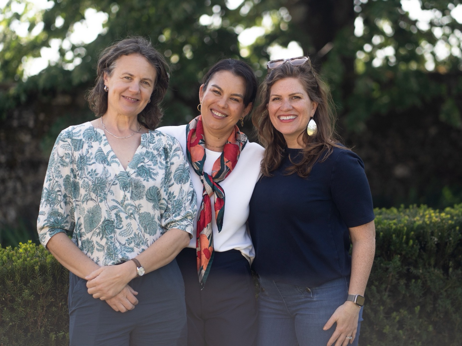 Three women smiling together